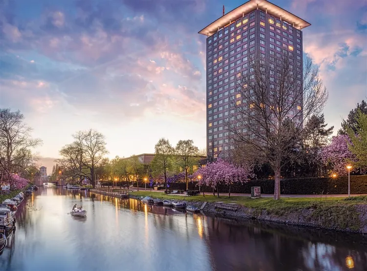 Hotel Okura Amsterdam at sunset along the canal